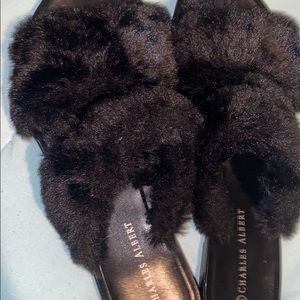 I am selling a Great pair of black fluffy sandals. They are a size 5/6